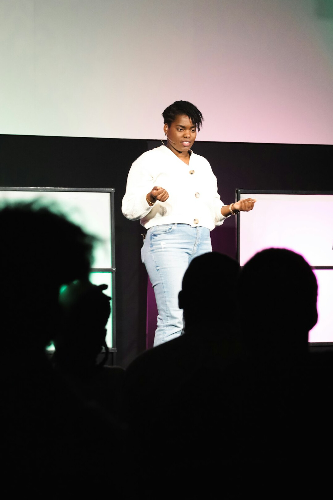 person speaking in front of audience